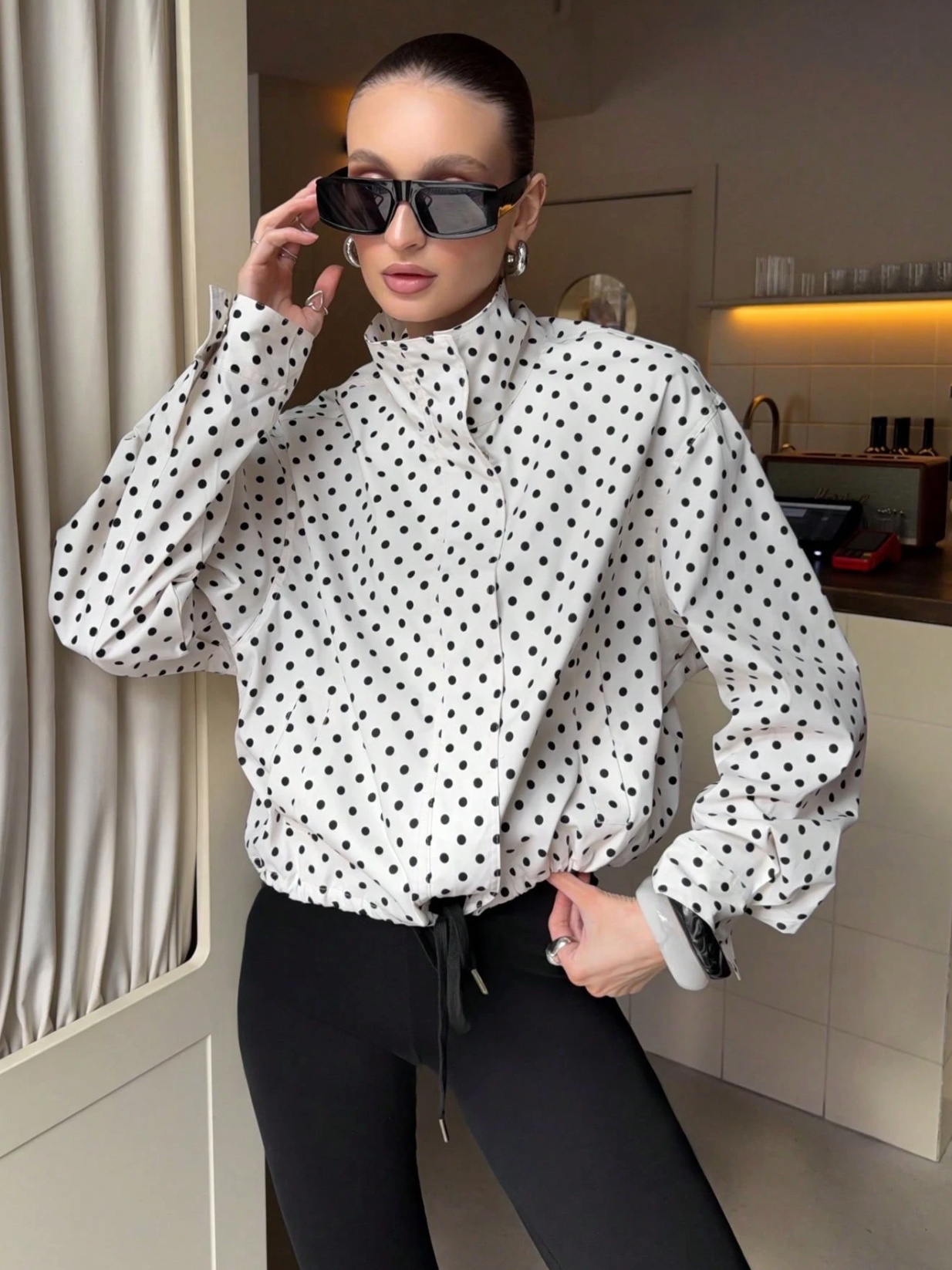 Activewear Model Posing in polka dot jacket