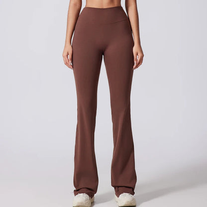 Brown high-waisted pants worn by a person on a white background
