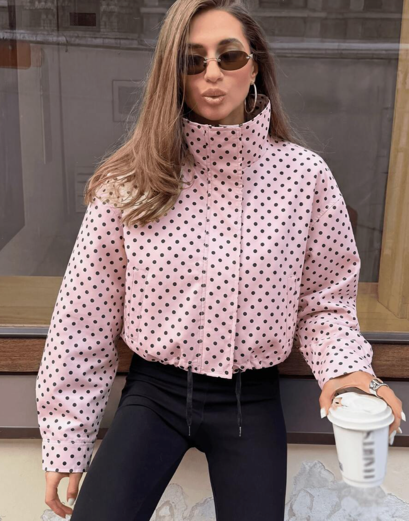 Activewear Model Posing in pink polka dot jacket