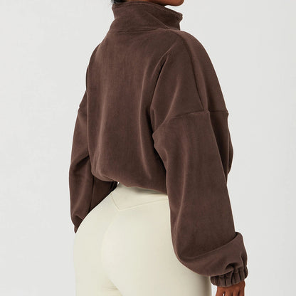 Woman wearing brown cropped sherpa zip jacket from Lolu Active