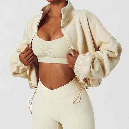 Cropped sherpa zip fleece shown with neutral activewear