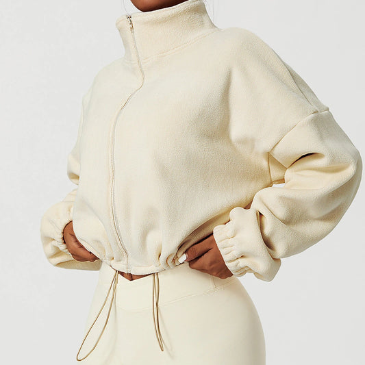 Model wearing cream Summit Sherpa Crop Zip jacket