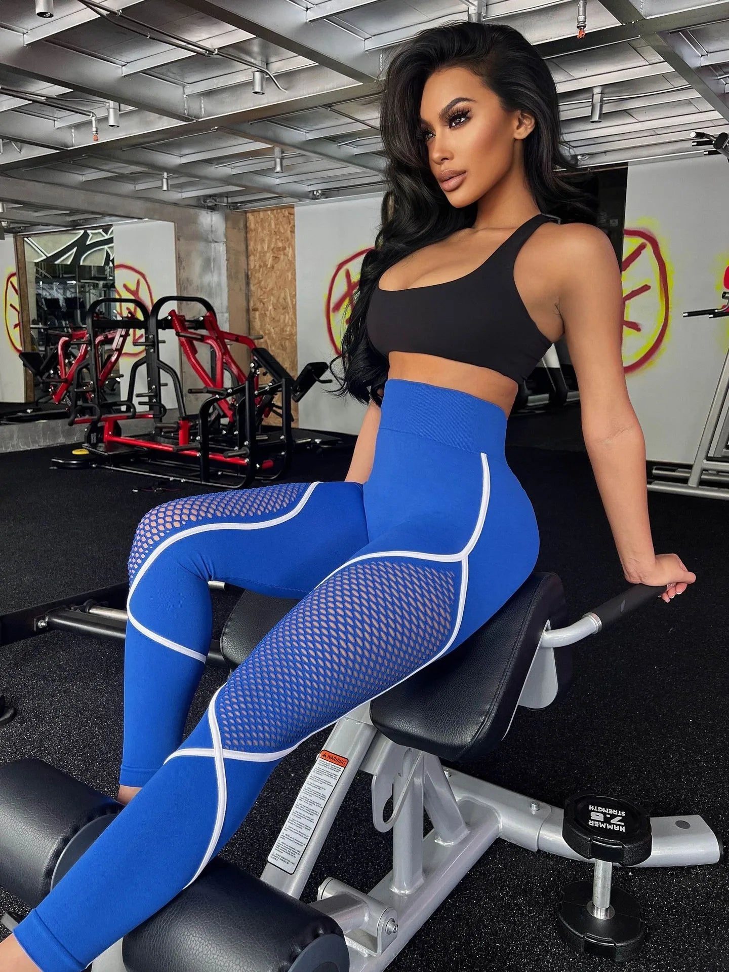 Model wearing electric blue contour mesh leggings with white seam detailing – VoltStream color