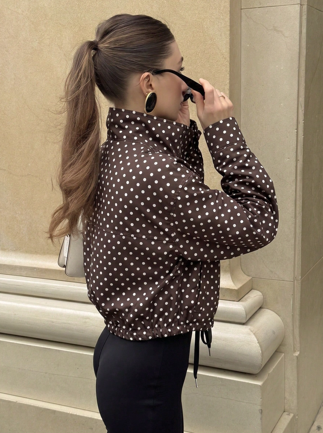 Activewear Model Posing in polka dot jacket