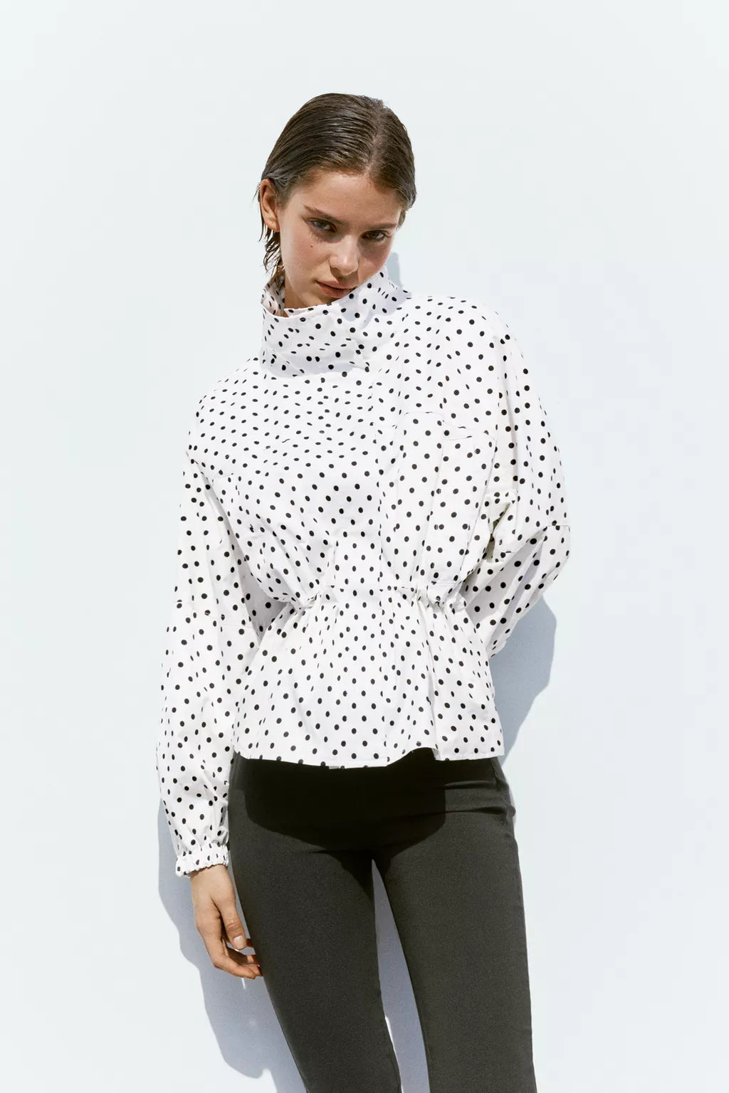 Activewear Model Posing in polka dot jacket