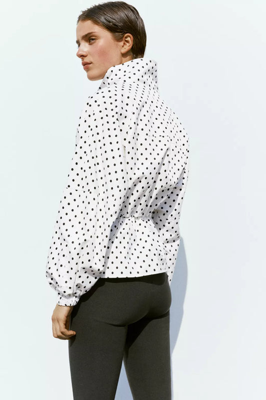 Activewear Model Posing in polka dot jacket