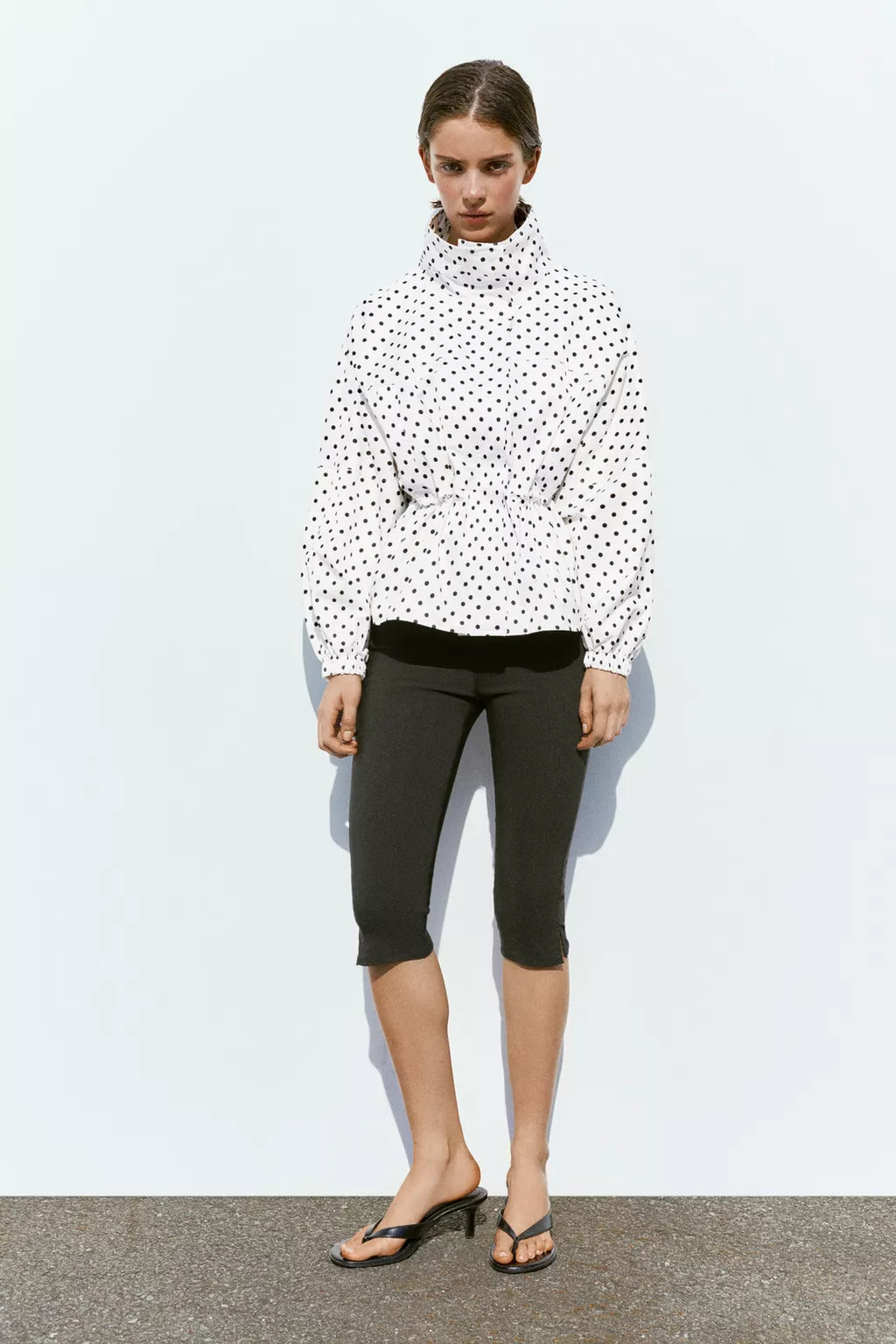 Activewear Model Posing in polka dot jacket