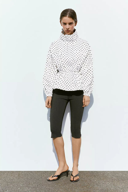 Activewear Model Posing in polka dot jacket