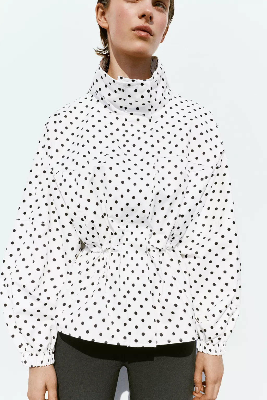 Activewear Model Posing in polka dot jacket