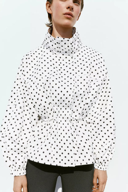 Activewear Model Posing in polka dot jacket